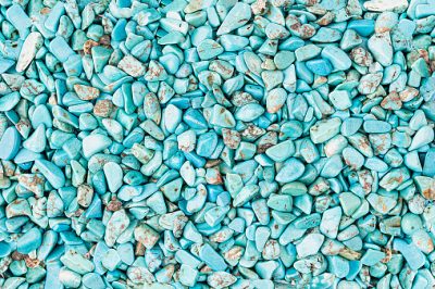 Small rounded turquoise stones textured background